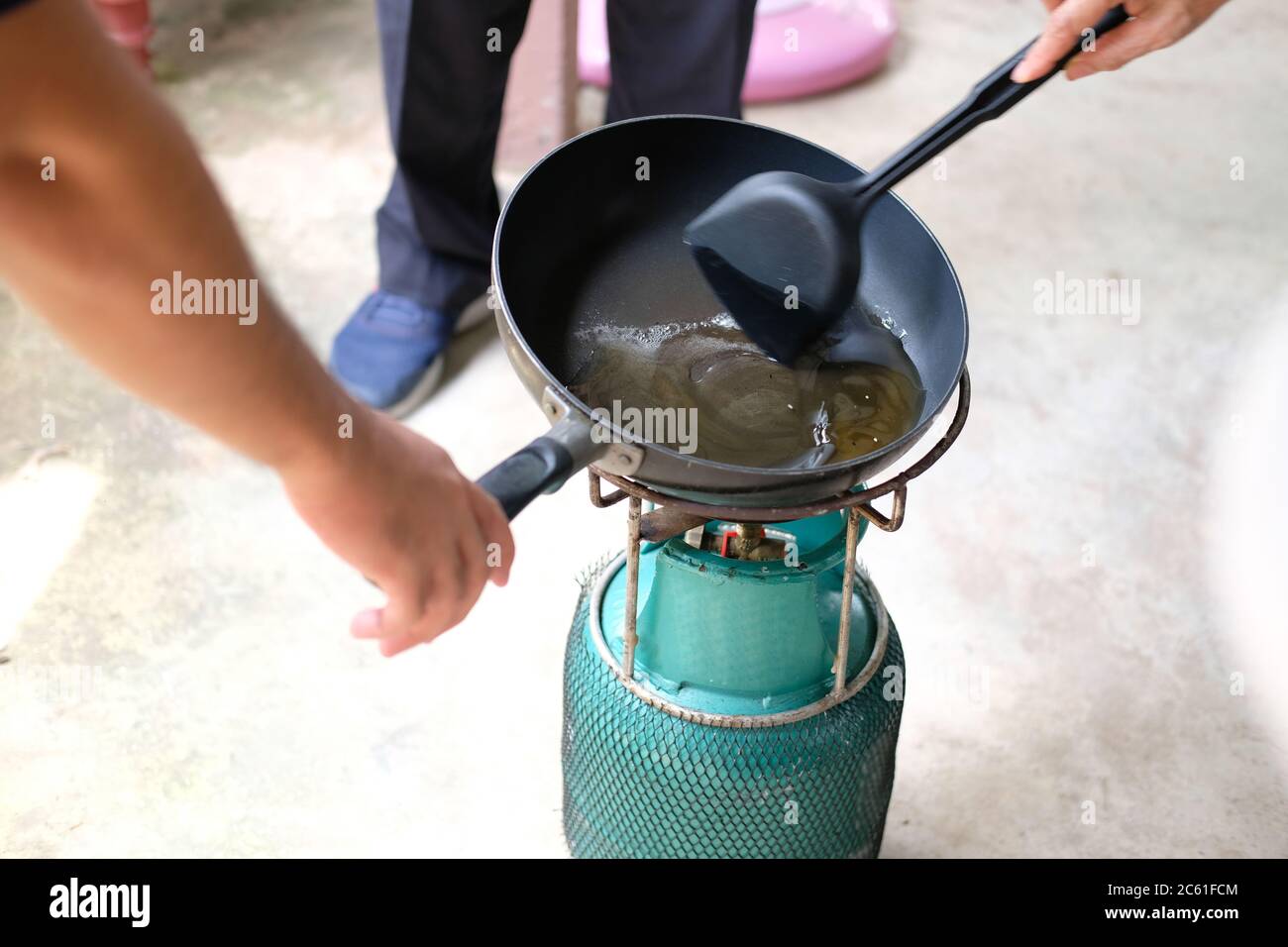 heating cooking boiling sugar caramel syrup in pan Stock Photo Alamy