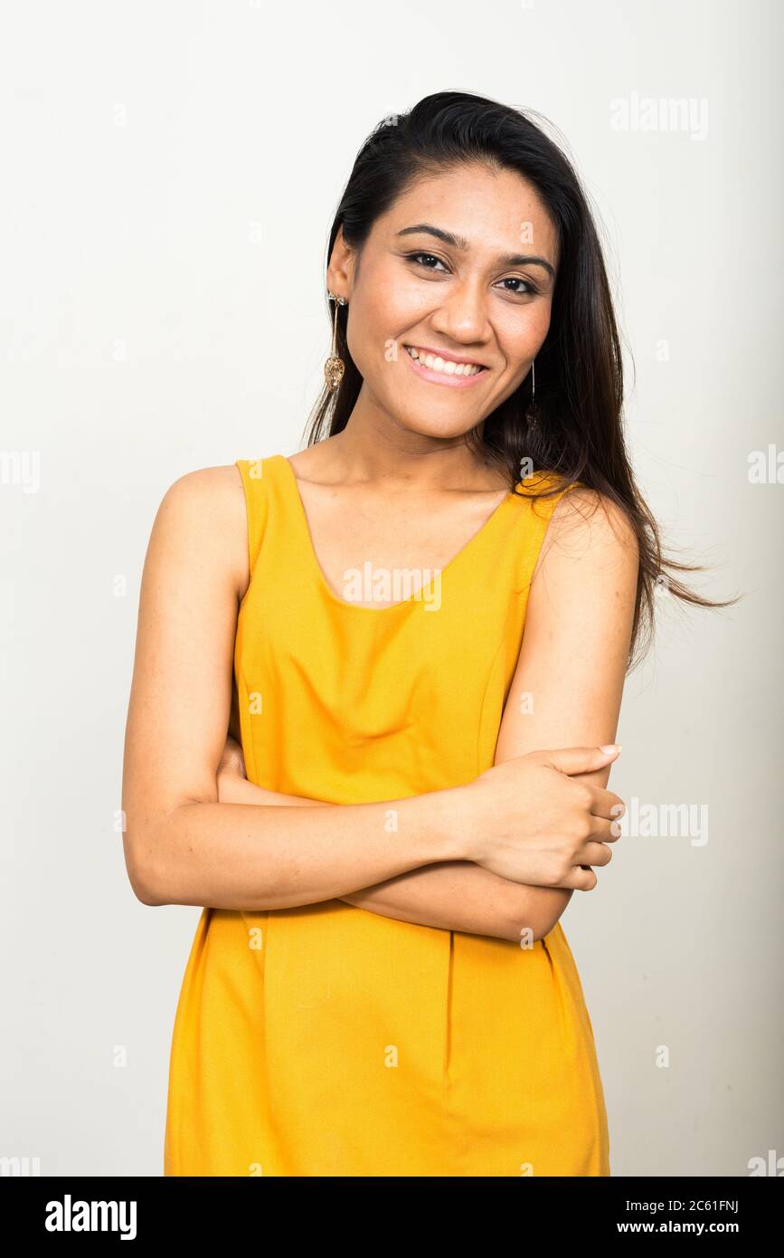 Portrait of happy Asian woman smiling with arms crossed Stock Photo - Alamy