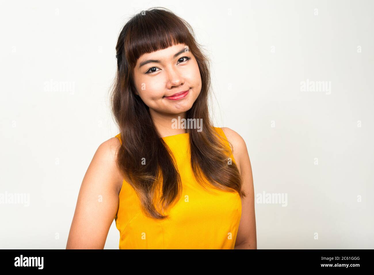 Portrait of young beautiful Asian woman looking at camera Stock Photo ...
