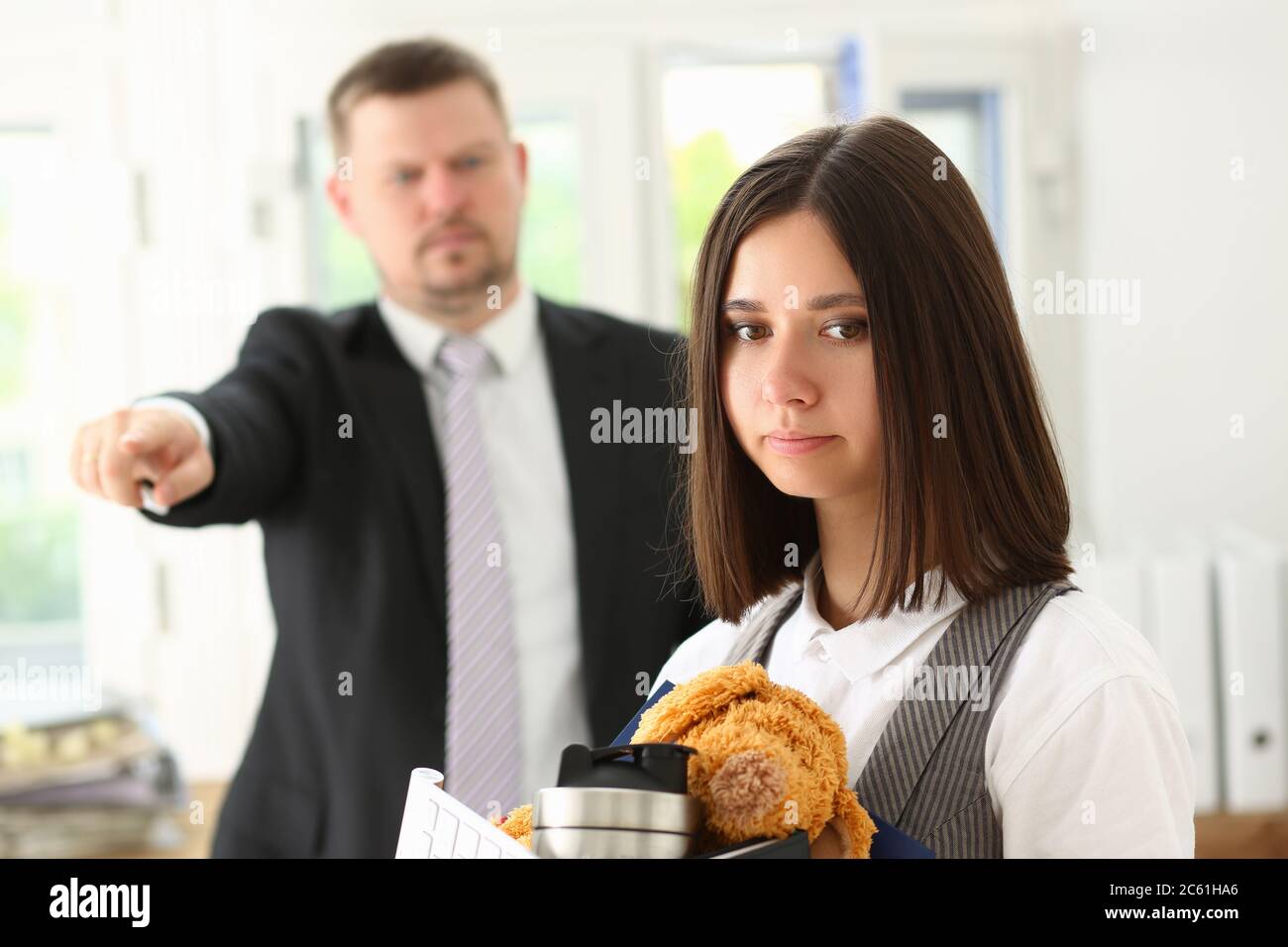 Female office worker getting fired from job Stock Photo