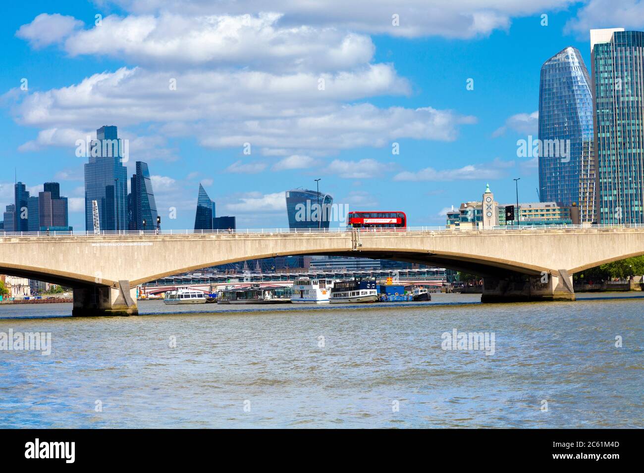 Red double decker bus on the Waterloo Bridge over the Thames river, London, UK Stock Photo