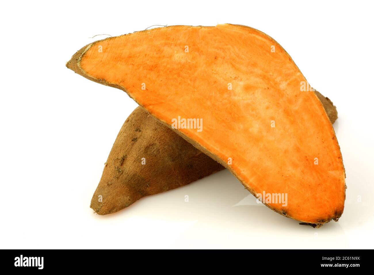 cut sweet potatoes on a white background Stock Photo