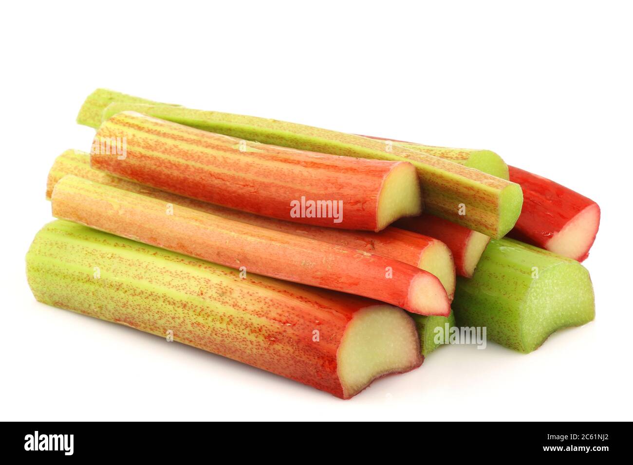 freshly  cut stems of rhubarb on a white background Stock Photo