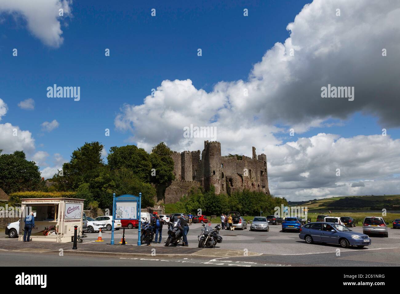 Laugharne, Carmarthenshire, Wales, UK. 6 July, 2020. On the first day that Wales' five mile travel restriction is lifted, people head to Laugharne, Carmarthenshire for a day out, with the car park near Laugharne castle full. Credit: Gruffydd Ll. Thomas/Alamy Live News Stock Photo