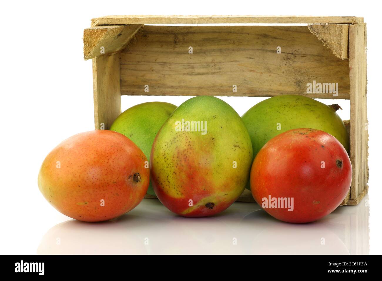fresh mango fruit in a wooden box on a white background Stock Photo - Alamy