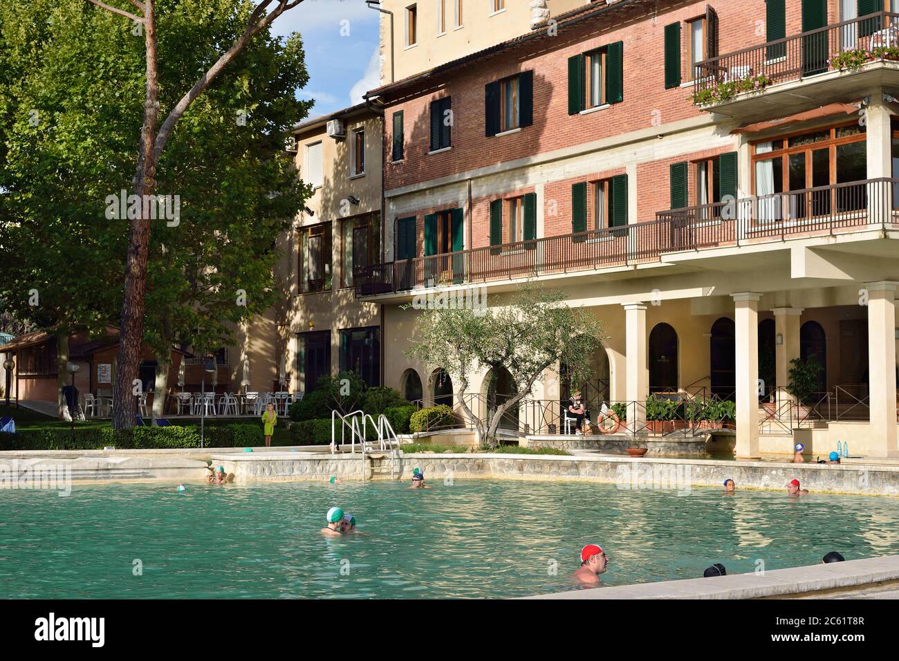 BAGNO VIGNONI, ITALY - OCT 13, 2012: Tourists have a rest in open thermal  pool of the Posta Marcucci Hotel. All season resort Stock Photo - Alamy
