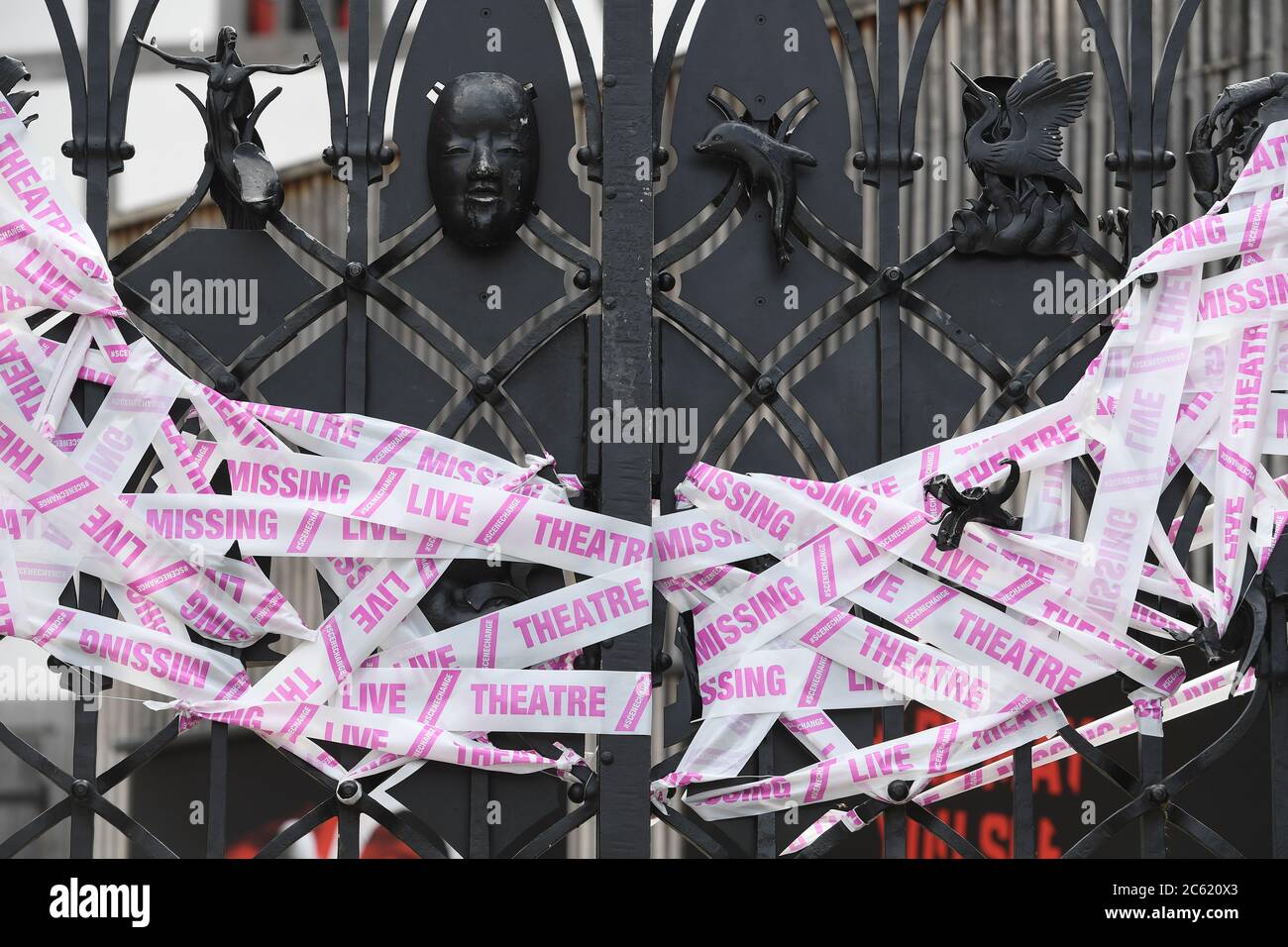 Tape covers the gates at Shakespeare's Globe theatre as a part of the Scene Change initiative, as the lifting of further lockdown restrictions in England comes into effect. Stock Photo