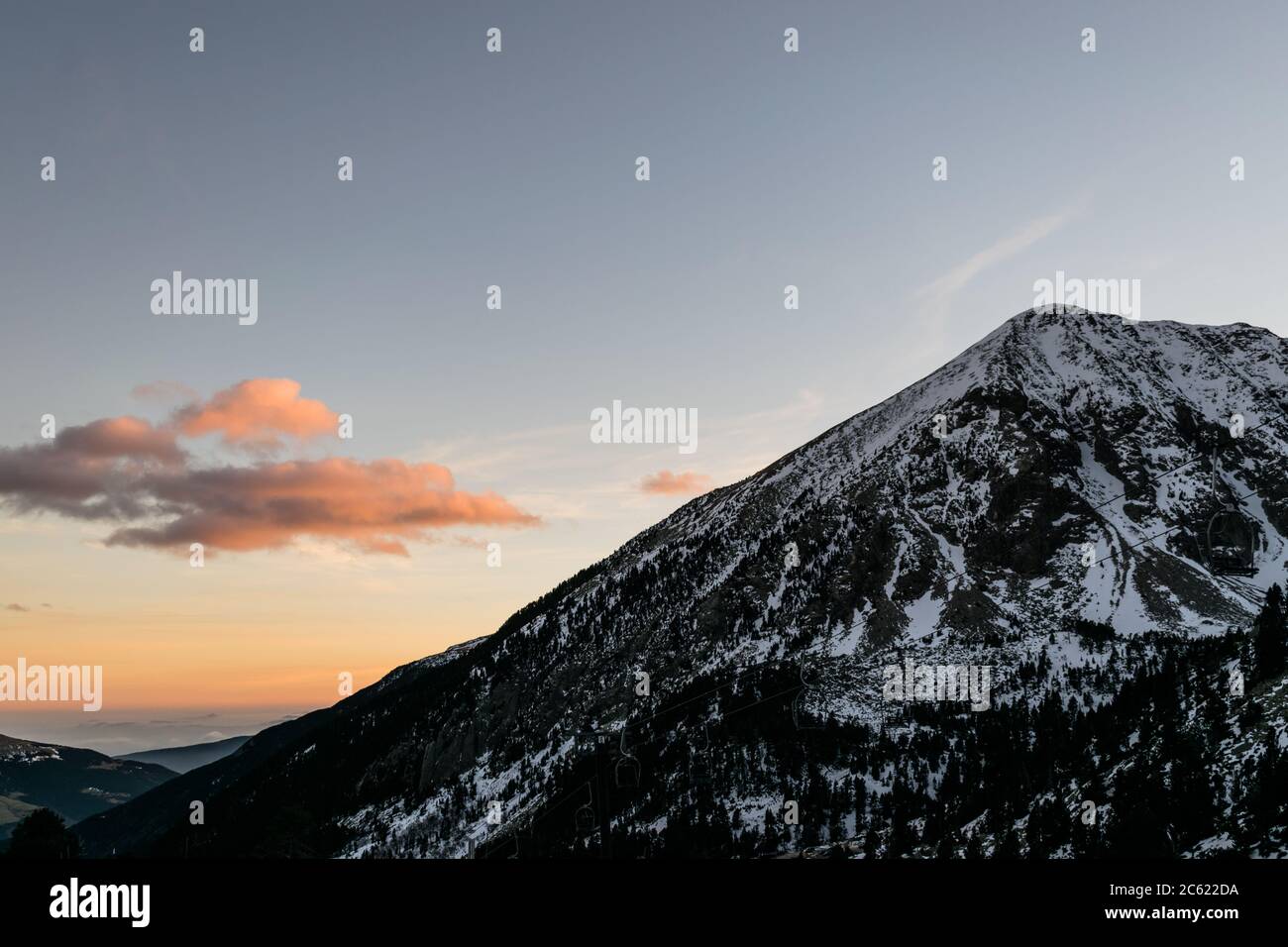 Views of a large snowy mountain during sunset Stock Photo - Alamy