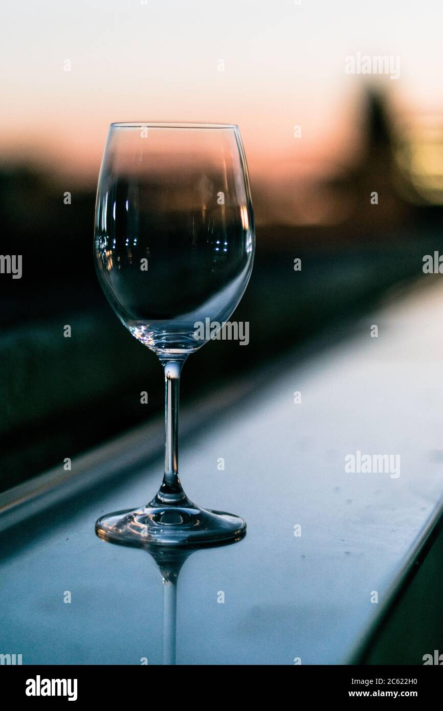 Empty glass cup at sunset close up view. Stock Photo