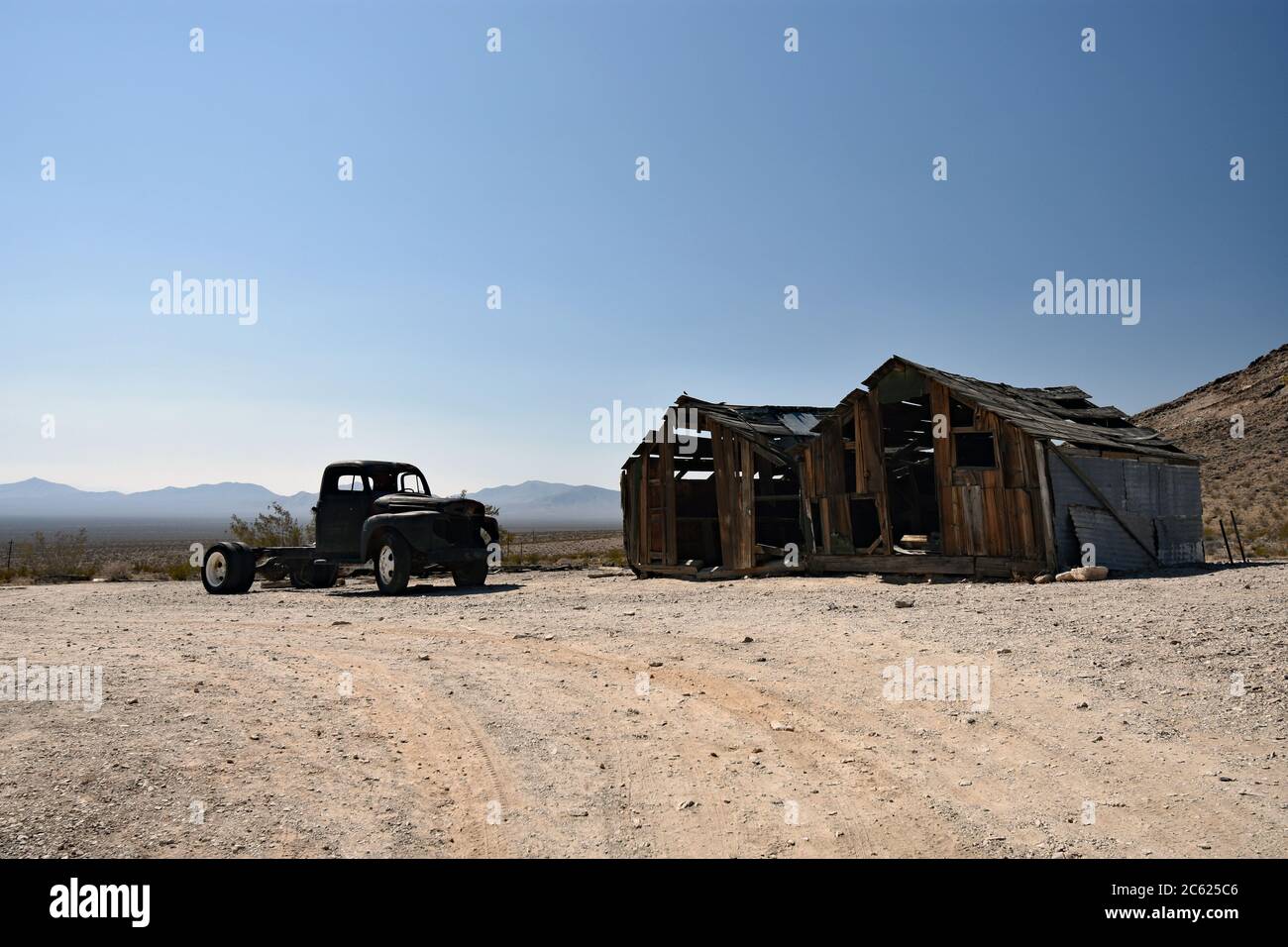 An abandoned pick up truck and dilapidated barn in the Nevada desert ...