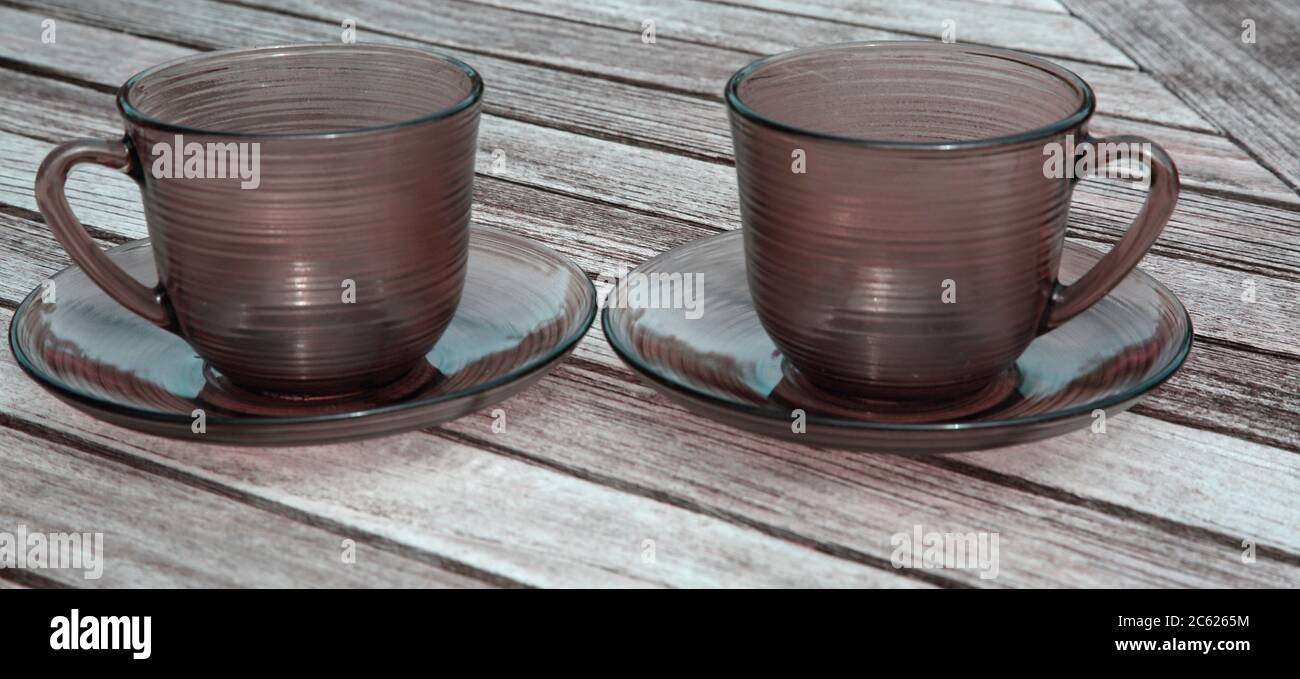 Vintage Smoked Coloured French Glass Cups and Saucers Stock Photo - Alamy