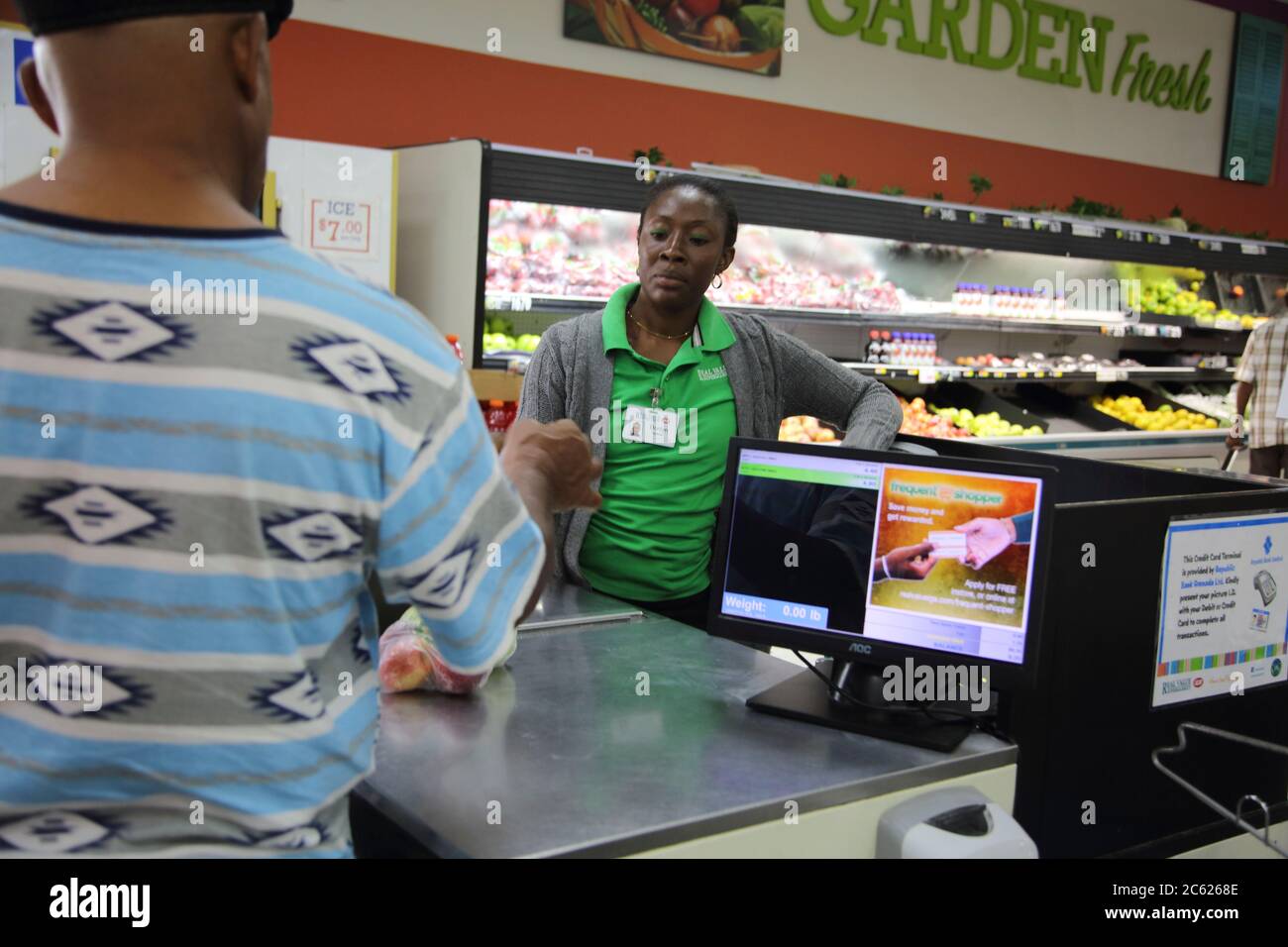 St George's Grenada Esplanade Mall Real Value Supermarket Cashier Serving Customer Stock Photo