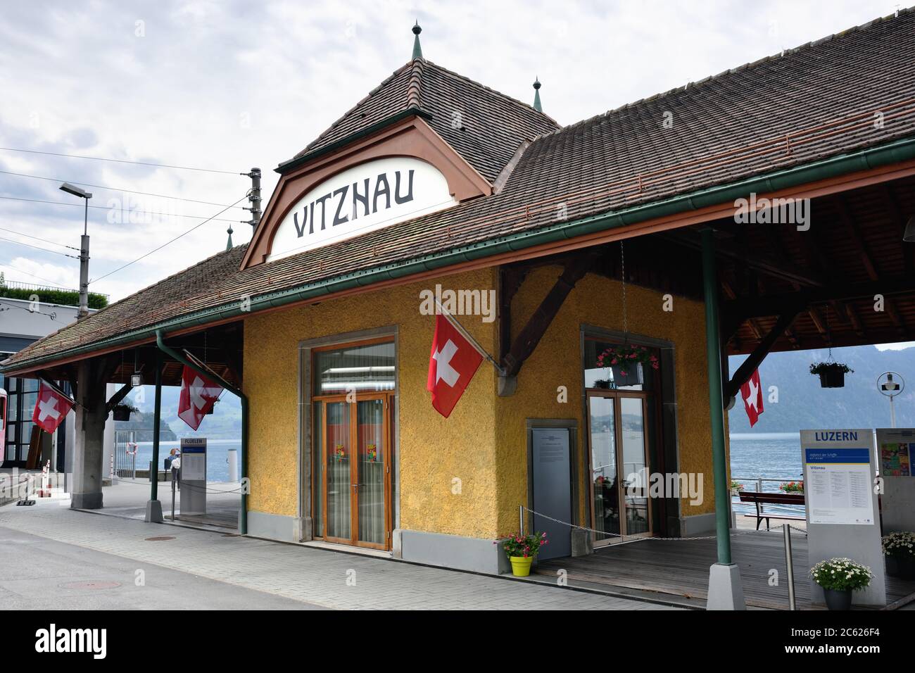 Vitznau, Switzerland - June 14, 2017: The Vitznau station on the coast of the Lucerne lake, popular tourist destination and point to start water cruis Stock Photo