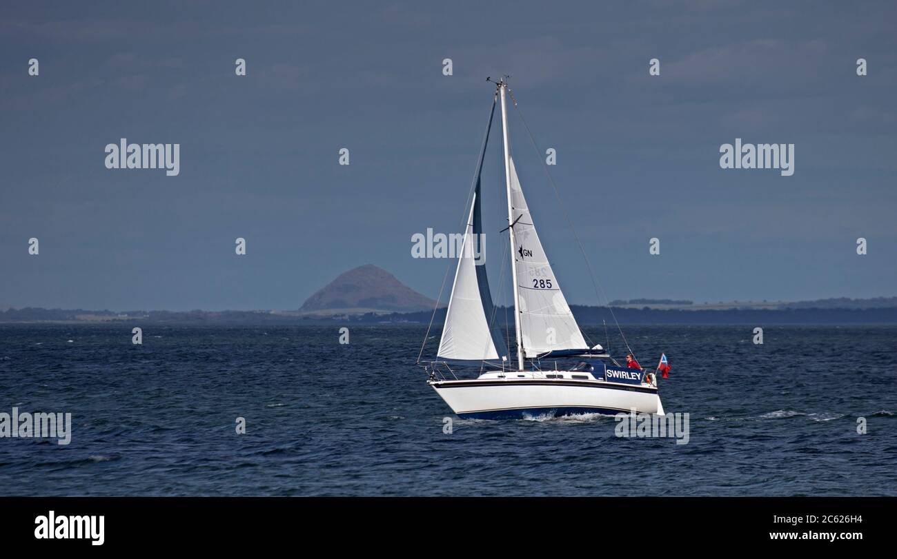 Portobello, Edinburgh, Scotland, UK. 6 July 2020. Good wind for sailing the Swirley in the Firth of Forth just off the coast of Portobello beach with Berwick Law in East Lothian in the background. W 22 km/h with potential gusts of 38 km/h and 17 degrees. Stock Photo