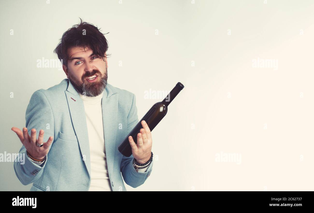 Young man drunk with a bottle of wine. Stock Photo
