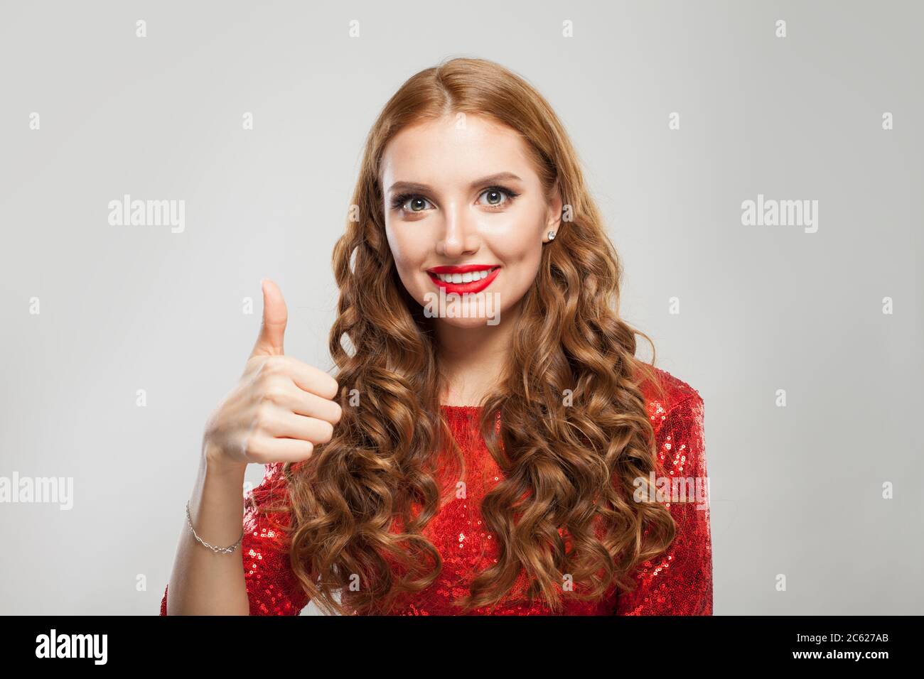 Beautiful woman showing thumb up on white background Stock Photo - Alamy