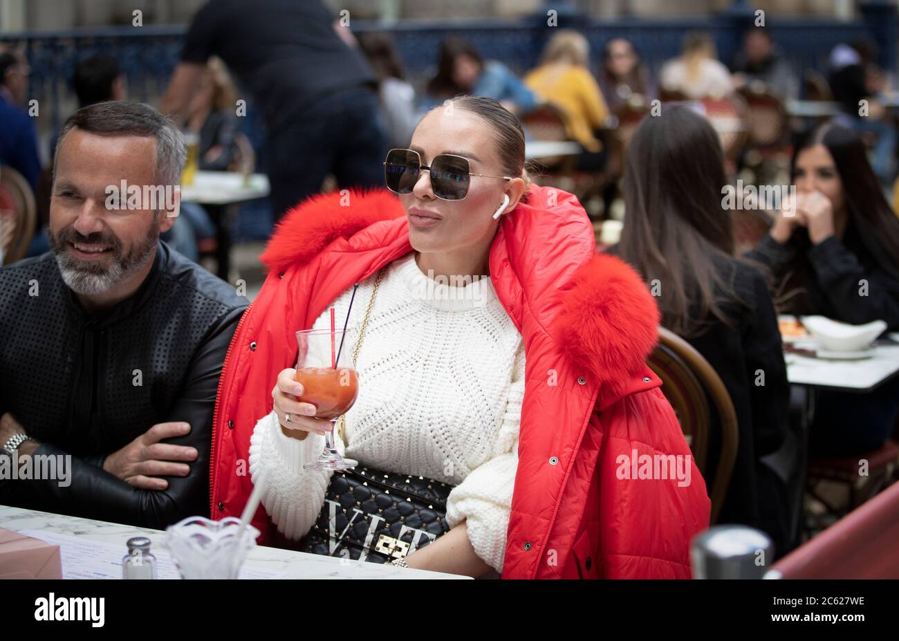 Members of the public enjoy their first drink at Di Maggio's outdoor restaurant area in Glasgow city centre, as outdoor areas reopen to the public for the first time as Scotland continues with the gradual lifting of restrictions to ease out of lockdown. Stock Photo