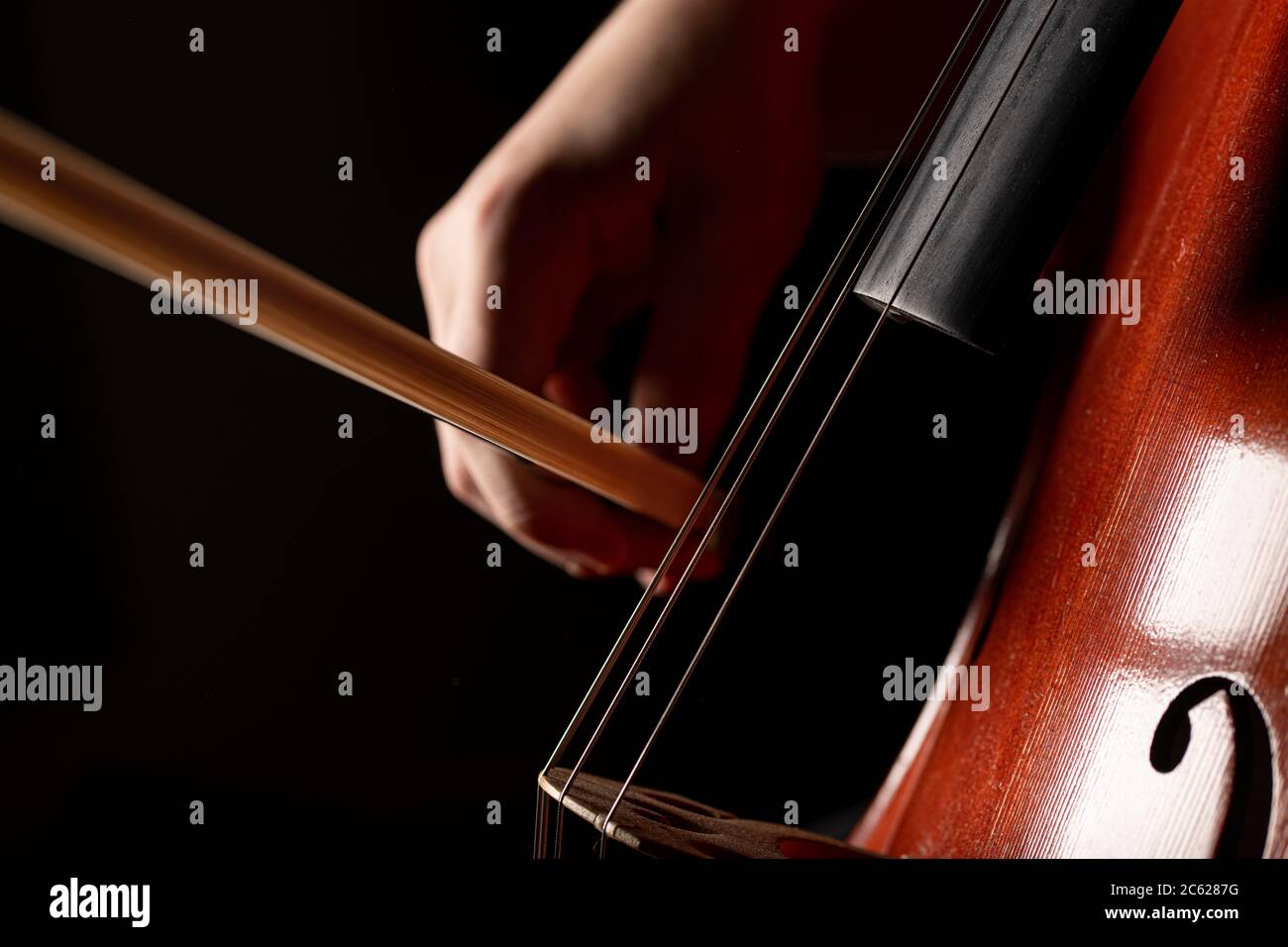 A young cellist practices classical music Stock Photo