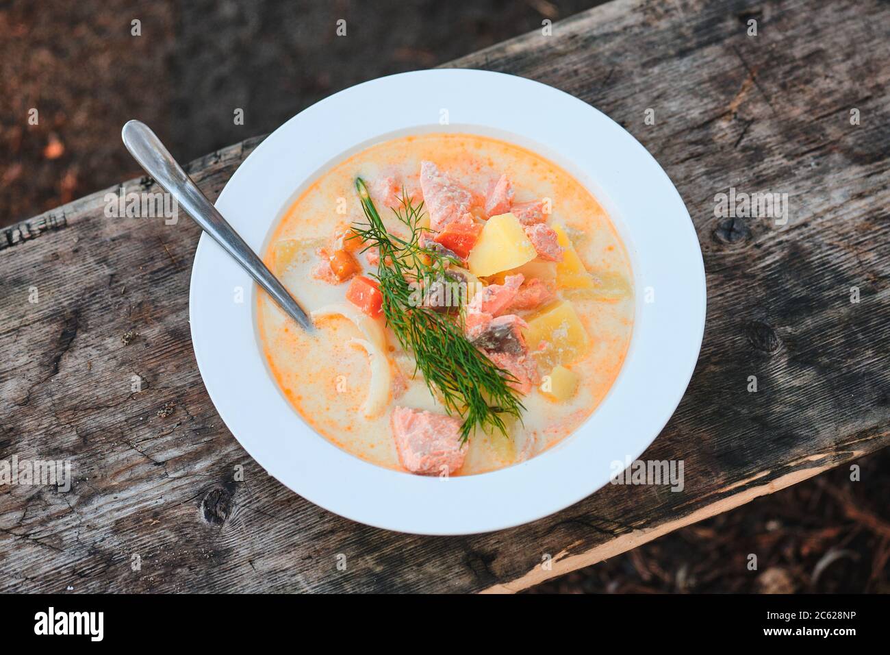 Traditional Finnish fish soup with salmon "lohikeito" cooked at the campfire Stock Photo Alamy