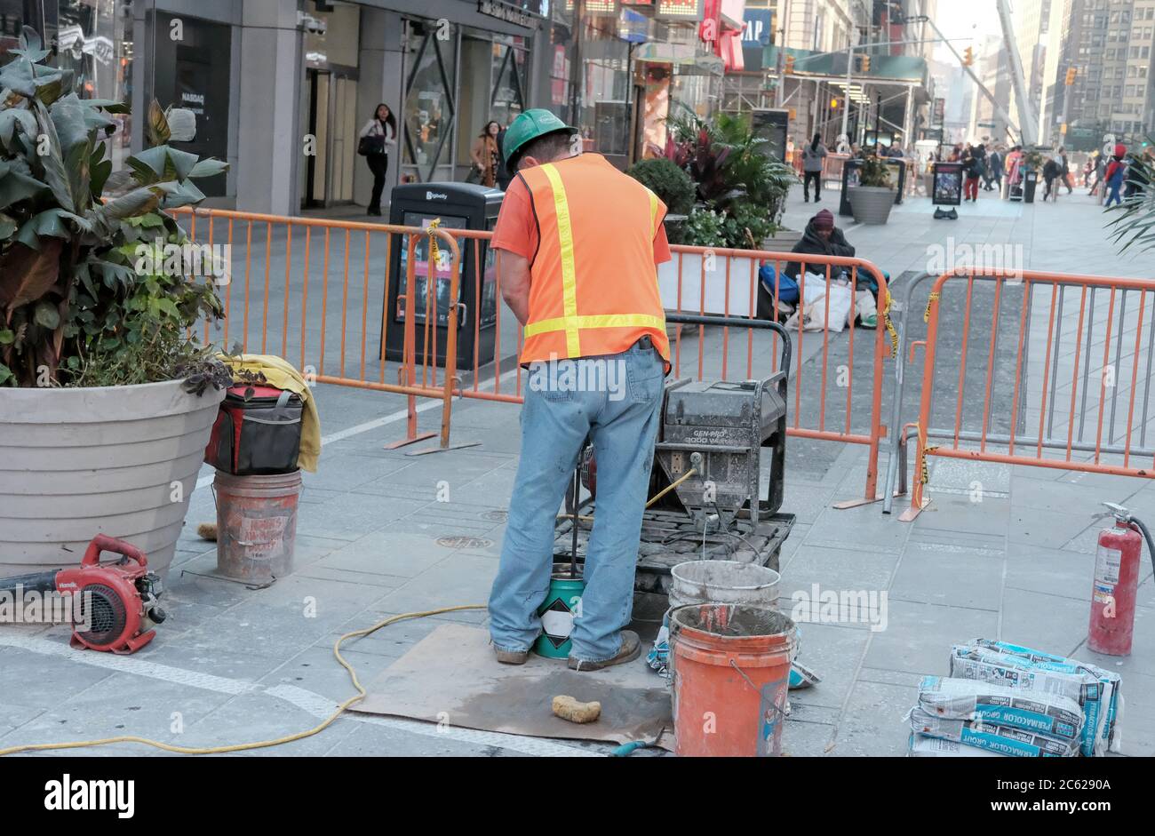 New York construction workers seen repairing roadways near Times Square