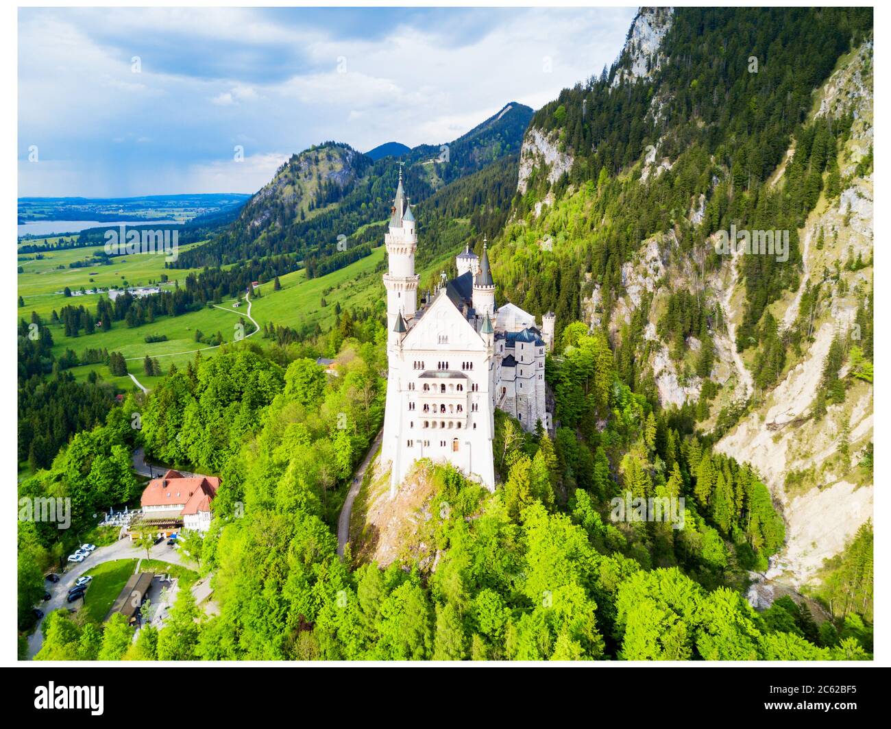 Schloss Neuschwanstein or New Swanstone Castle aerial panoramic view. Neuschwanstein Castle is a Romanesque Revival palace in Hohenschwangau village n Stock Photo