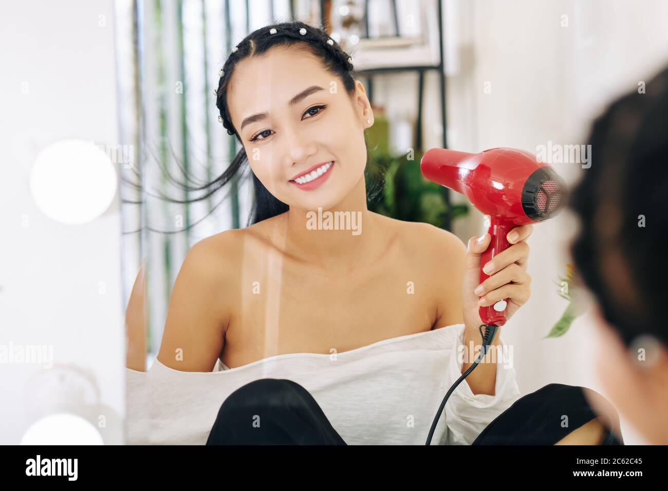 drying hair with fan
