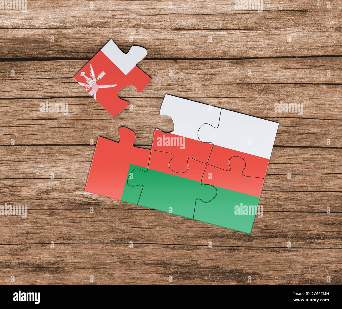 Oman national flag on jigsaw puzzle. One piece is missing. Danger concept. Stock Photo