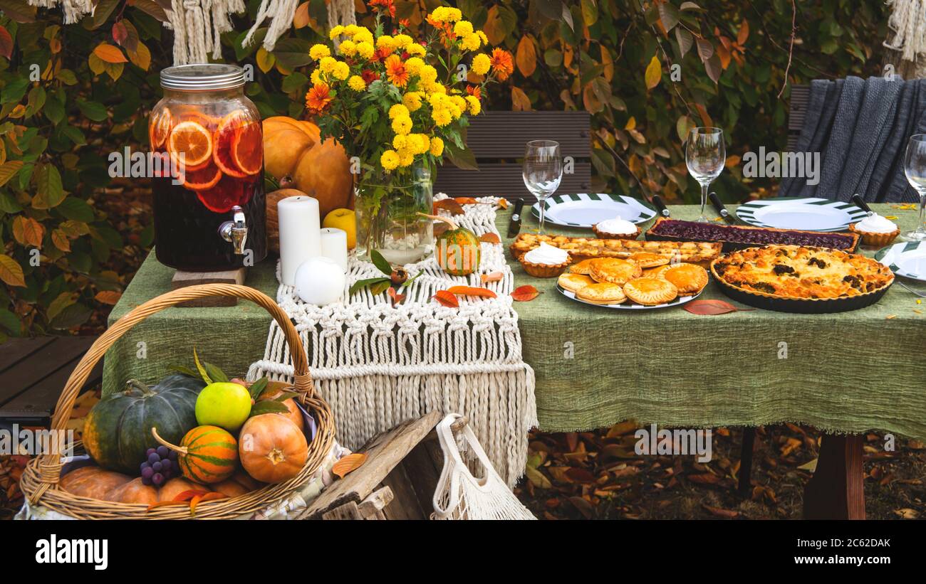 Autumn brunch table in the backyard with pumpkin and yellow decor Stock  Photo - Alamy