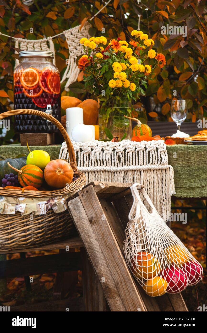 Autumn brunch table in the backyard with pumpkin and yellow decor Stock