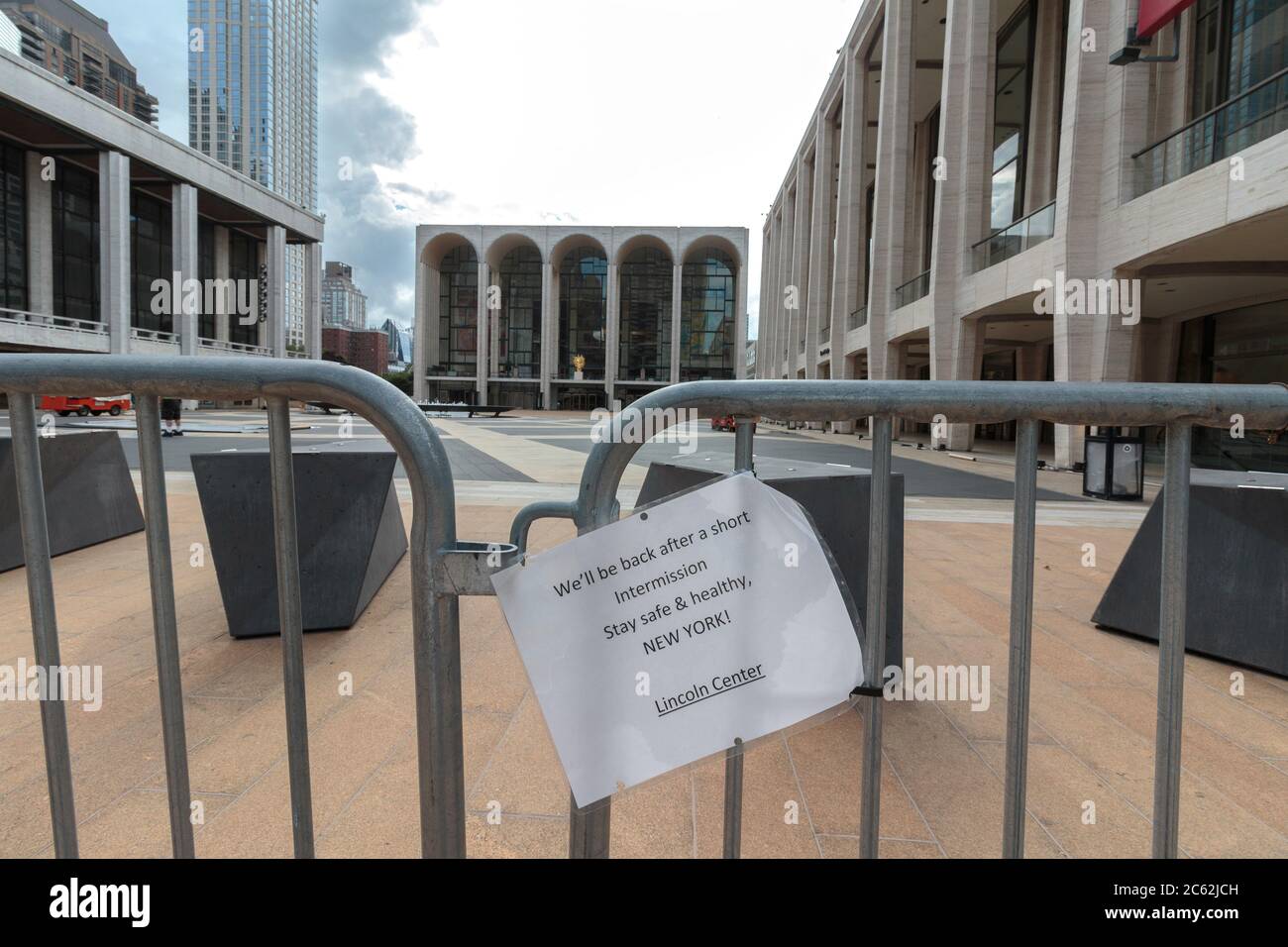 sarcastic sign on a barrier in front of the metropolitan opera house, closed due to the coronavirus or covid-19 pandemic, saying it is in intermission Stock Photo