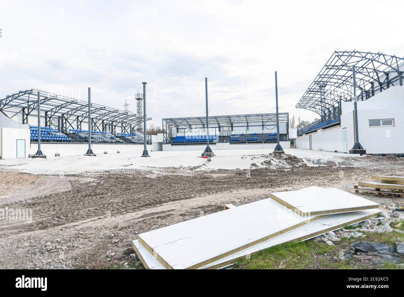 Front view of new and small stadium for summer games under construction on a cloudy spring day. Conctruction idea concept, background Stock Photo