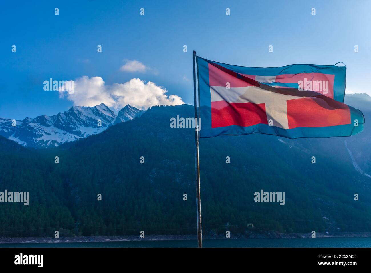 Flag of Piedmont region over the Ceresole Lake, Italy Stock Photo