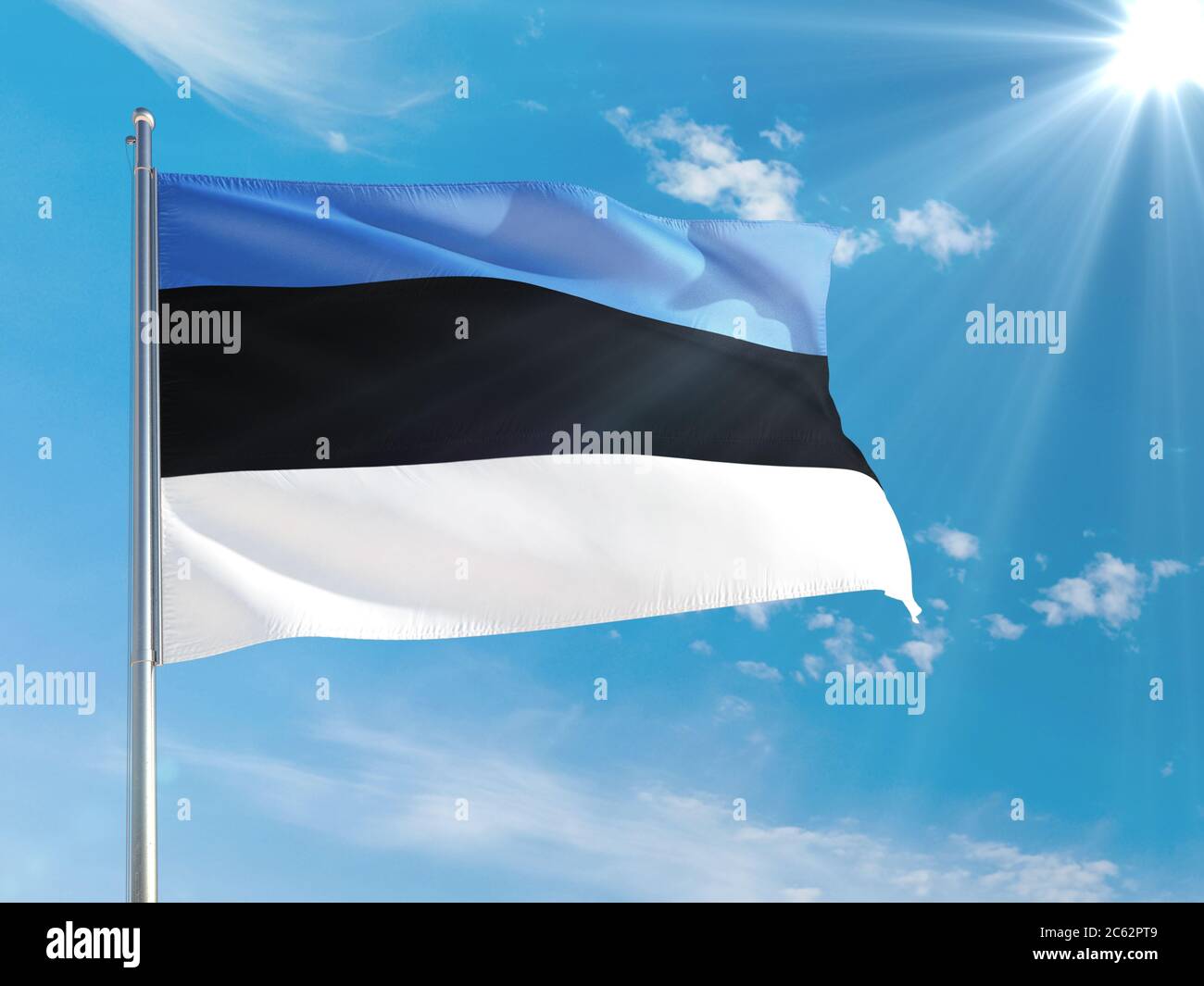 Estonia national flag waving in the wind against deep blue sky. High ...