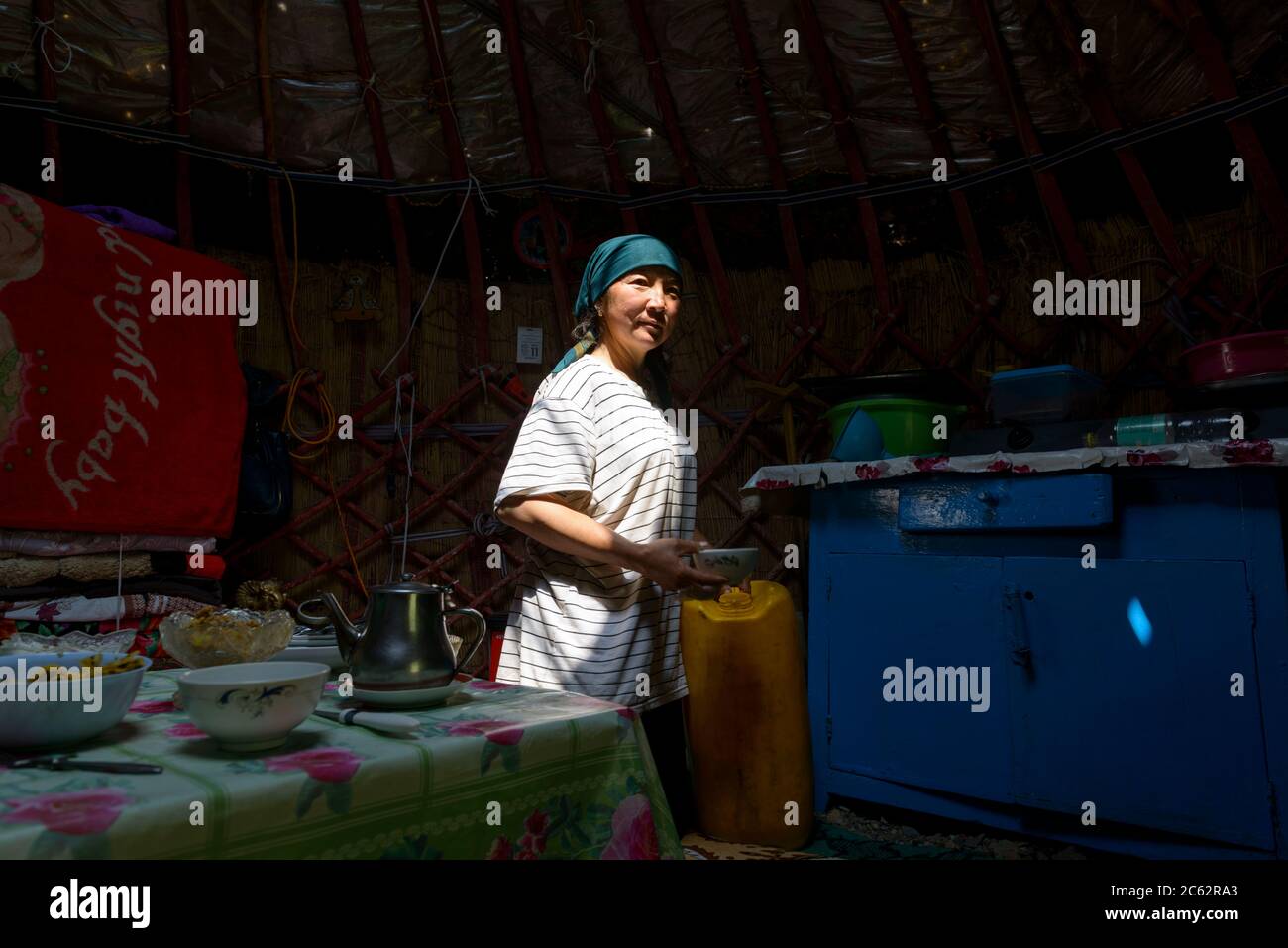 Woman preparing food in a yurt. Kyrgyzstan Stock Photo