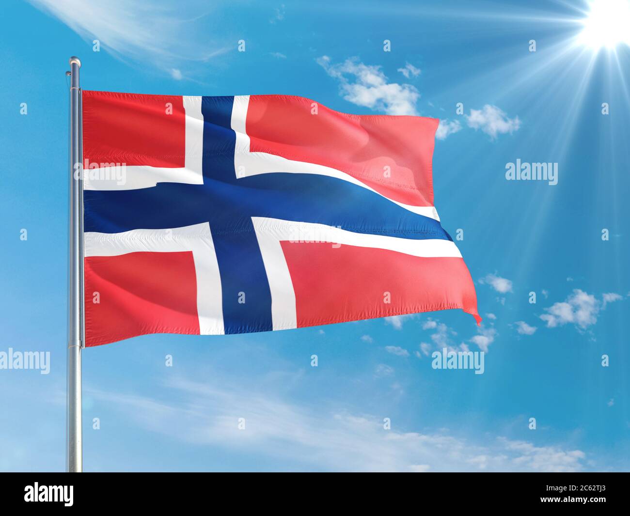 Norway national flag waving in the wind against deep blue sky. High ...