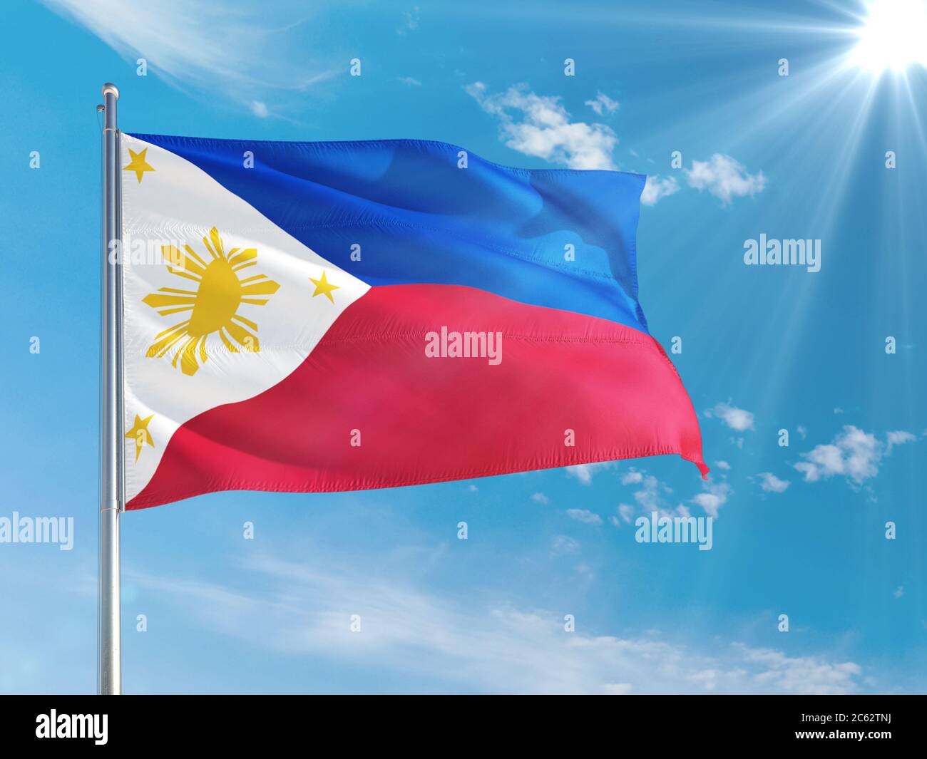 Philippines national flag waving in the wind against deep blue sky ...