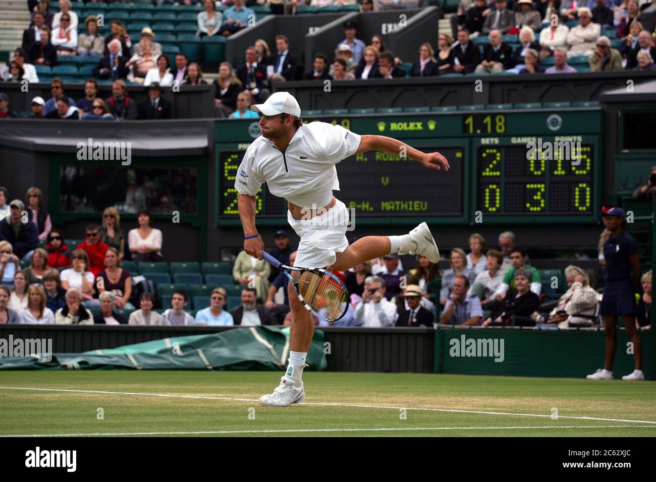 Andy Roddick in action against Paul-Henri Mathieu during their fourth round match at Wimbledon in 2007. Stock Photo