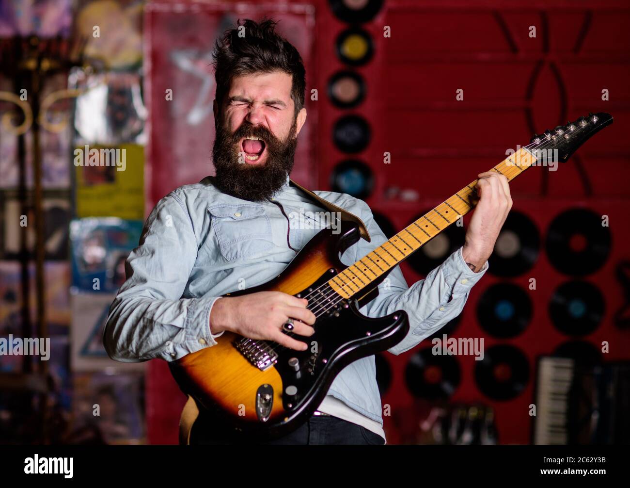 Singer Shouting Rock singer concept. Musician with beard play electric guitar musical ...
