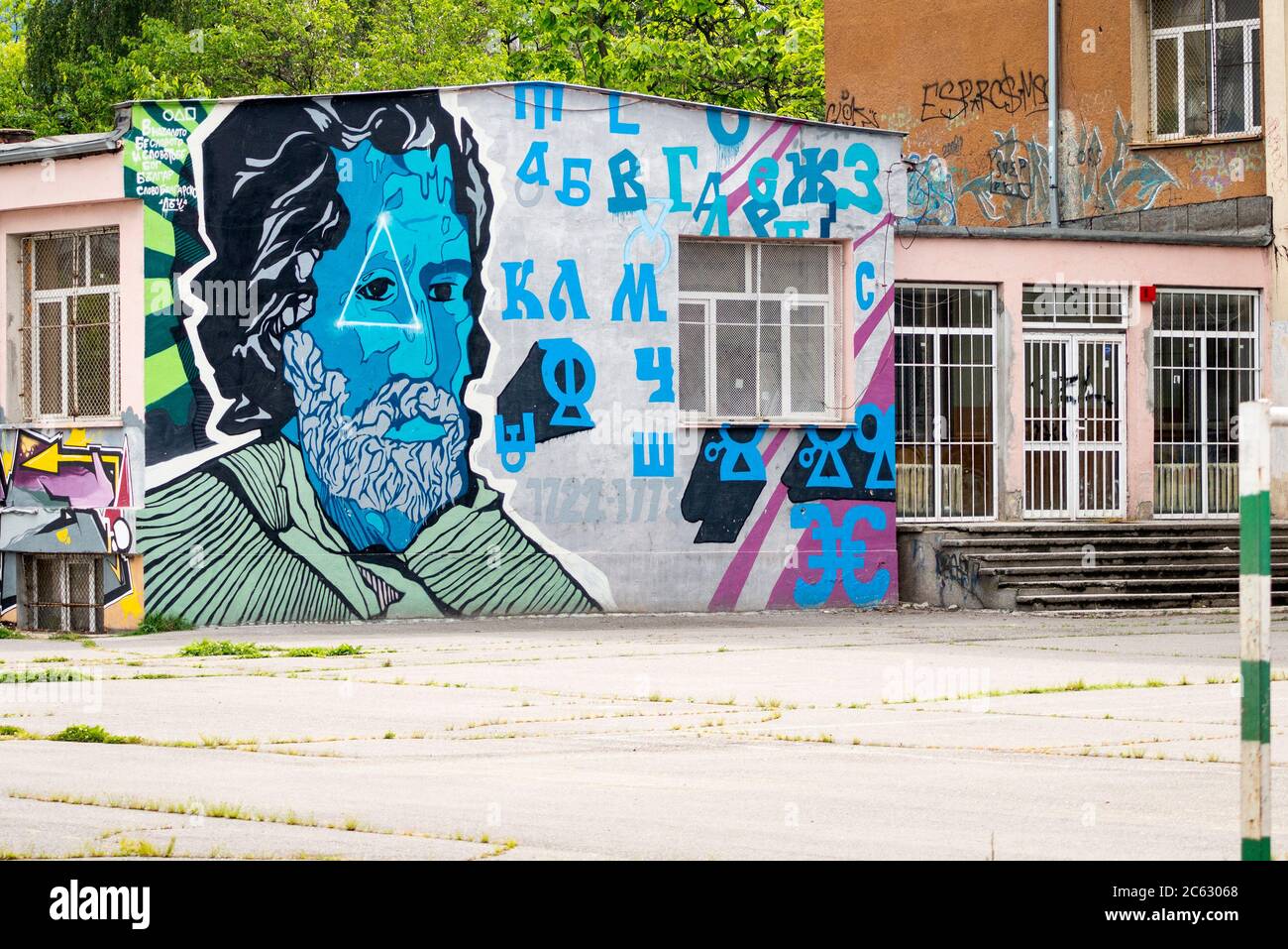 Cyrillic script and Alphabet letters graffiti on school facade in Sofia Bulgaria Stock Photo
