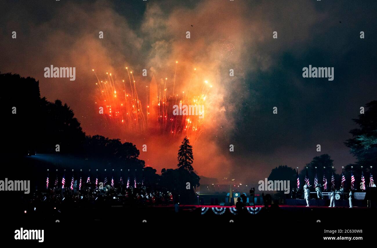 Fireworks explode over the National Mall during the annual Independence Day celebration on the South Lawn of the White House July 4, 2020 in Washington, DC.  - Stock Photo