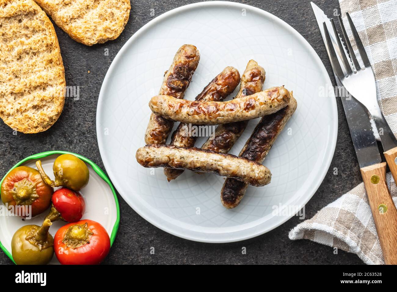 Grilled white sausages on plate. Top view. Stock Photo