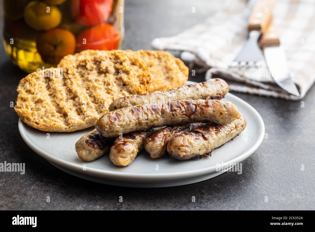 Grilled white sausages on plate. Stock Photo