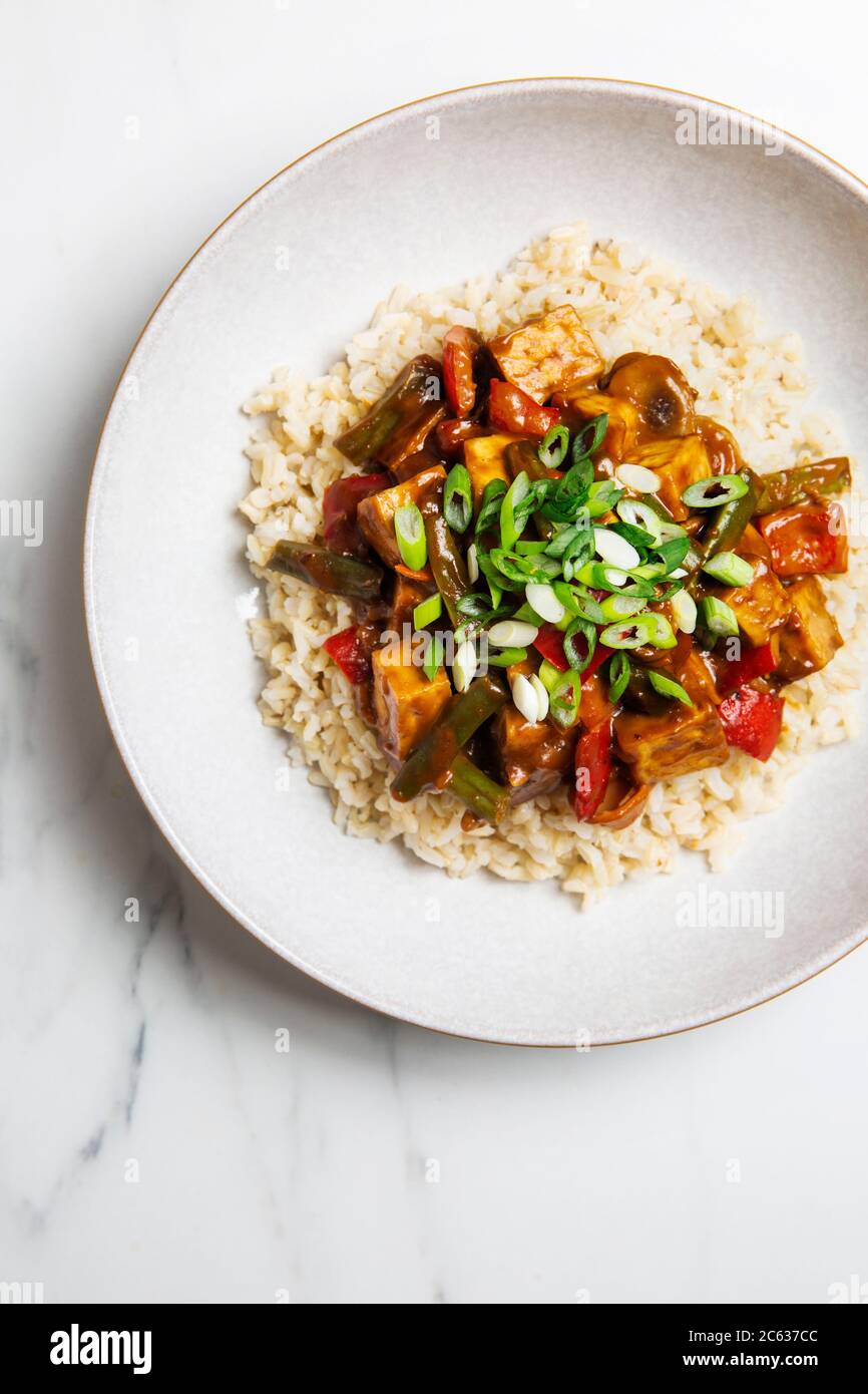 Vegan Almond Butter Stir Fry topped with saucexn Stock Photo Alamy