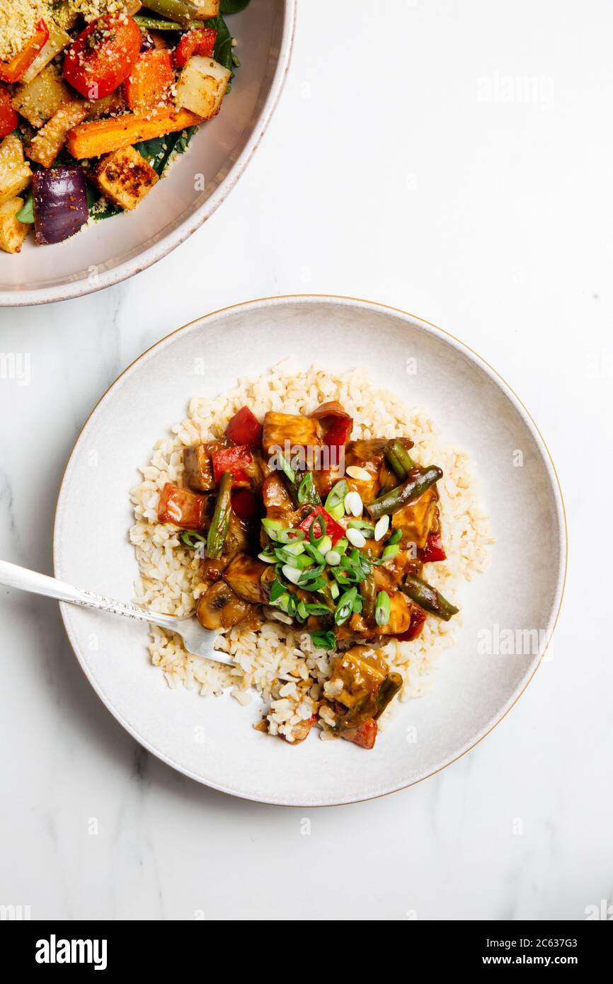 Vegan Almond Butter Stir Fry topped with sauce Stock Photo Alamy