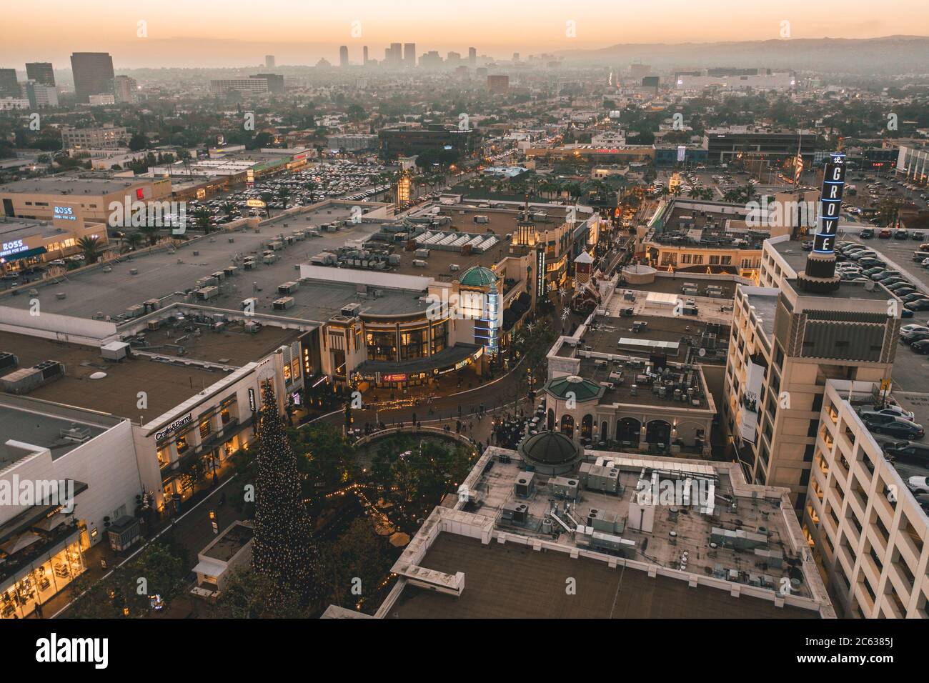 The Grove Shopping Center in Los Angeles at Sunset with Shops and Hollywood Skyline in the distance HQ Stock Photo