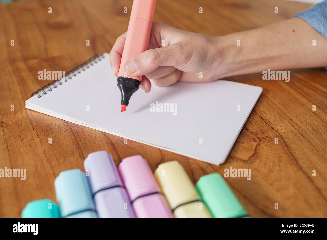 Drawing on a white sheet with a color highlighter Stock Photo