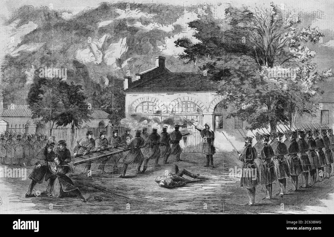 The Harper's Ferry insurrection -The U.S. Marines storming the engine house - Insurgents firing through holes in the doors. 1859 Stock Photo