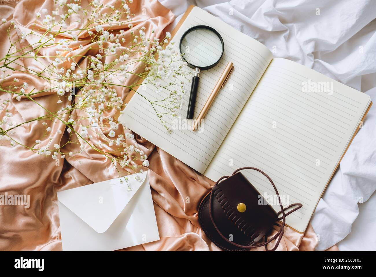 White gypsophila flowers with notebook Stock Photo - Alamy