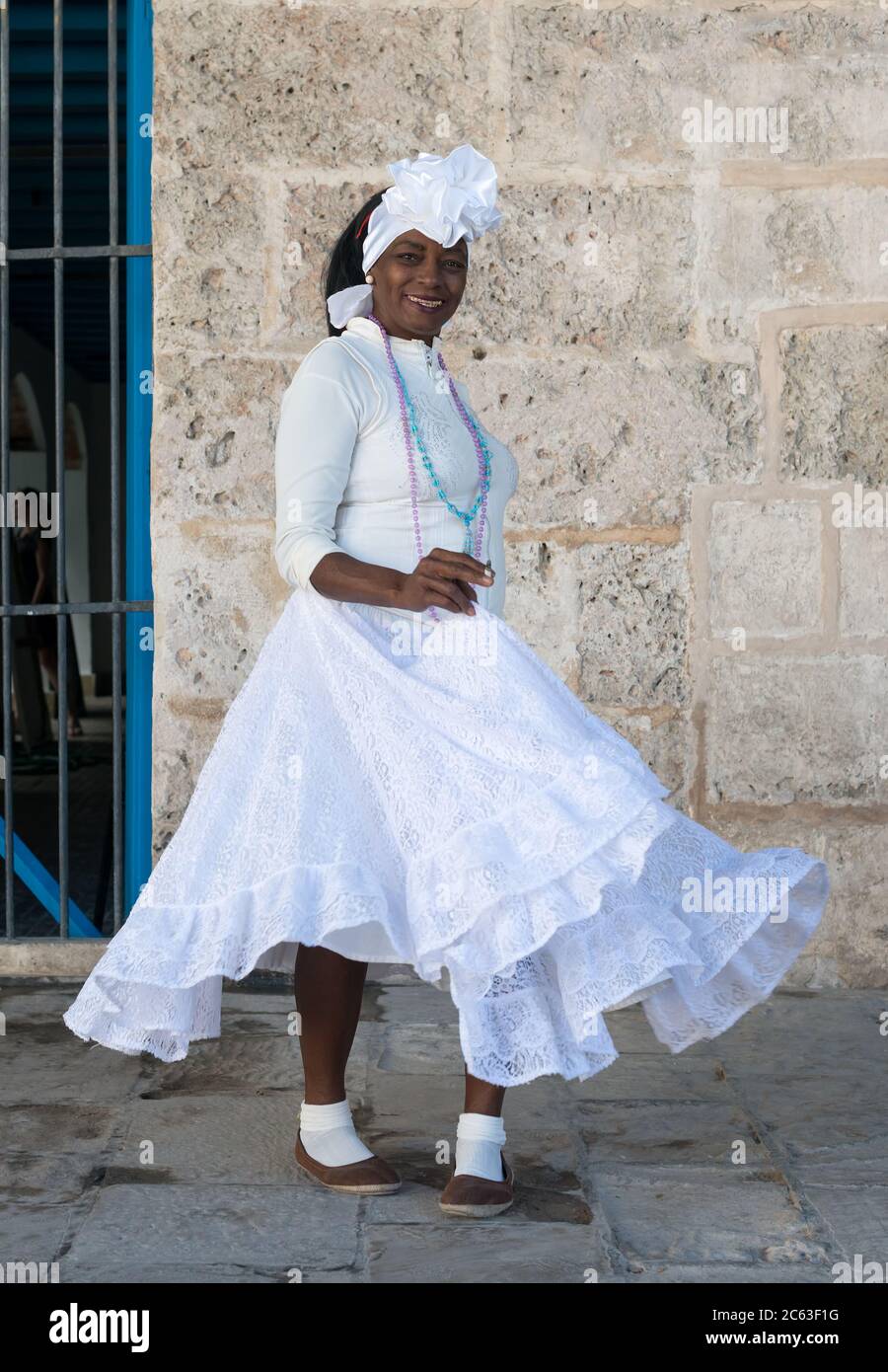 Portrait of a  black cuban woman wearing a white traditional dress Stock Photo