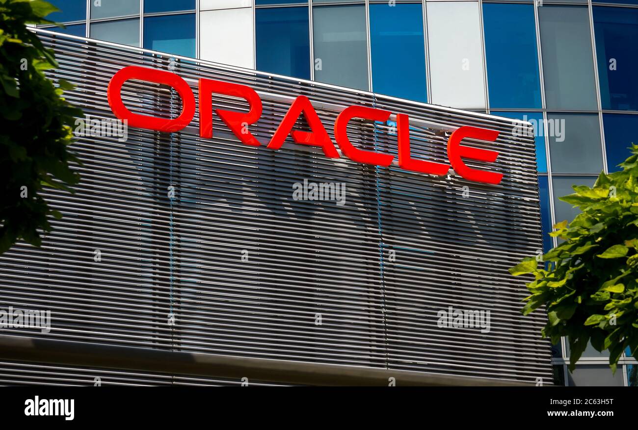 Bucharest, Romania - June 25, 2020: Oracle logo is seen on top of an architectural metal fence at ground floor of SkyTower office building in Buchares Stock Photo